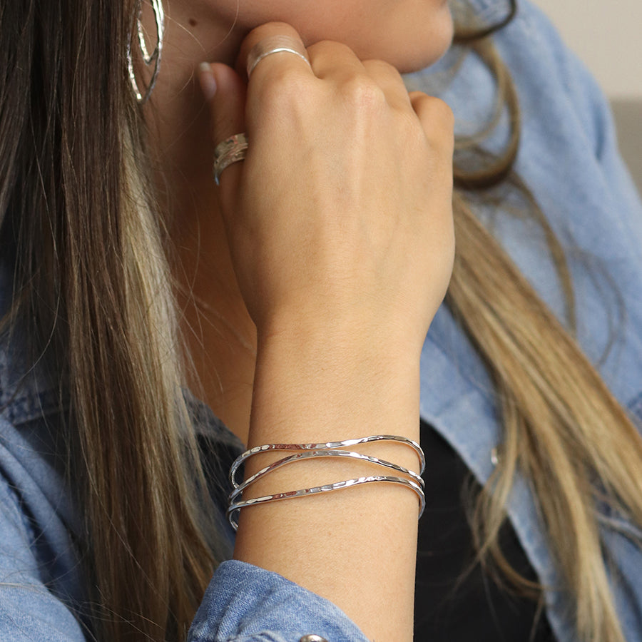 Silver plated hammered triple wave strand bangle
