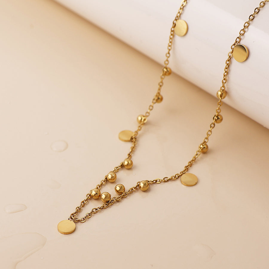 Waterproof gold plated bead and disc charm necklace