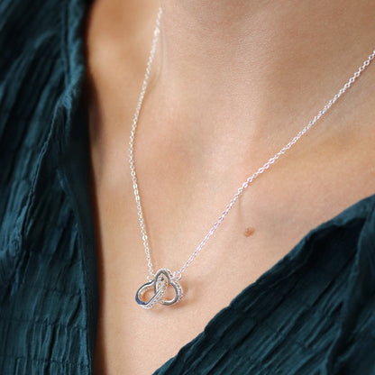 Silver plated crystal edged linked hearts necklace