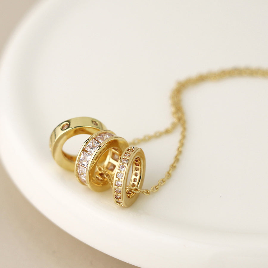 Gold plated triple mini crystal rings necklace