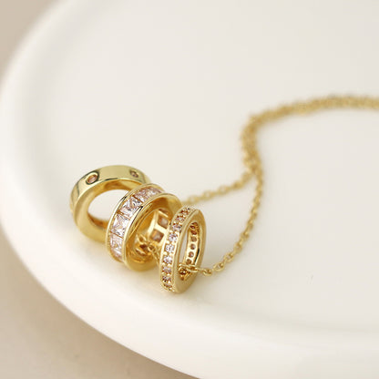 Gold plated triple mini crystal rings necklace