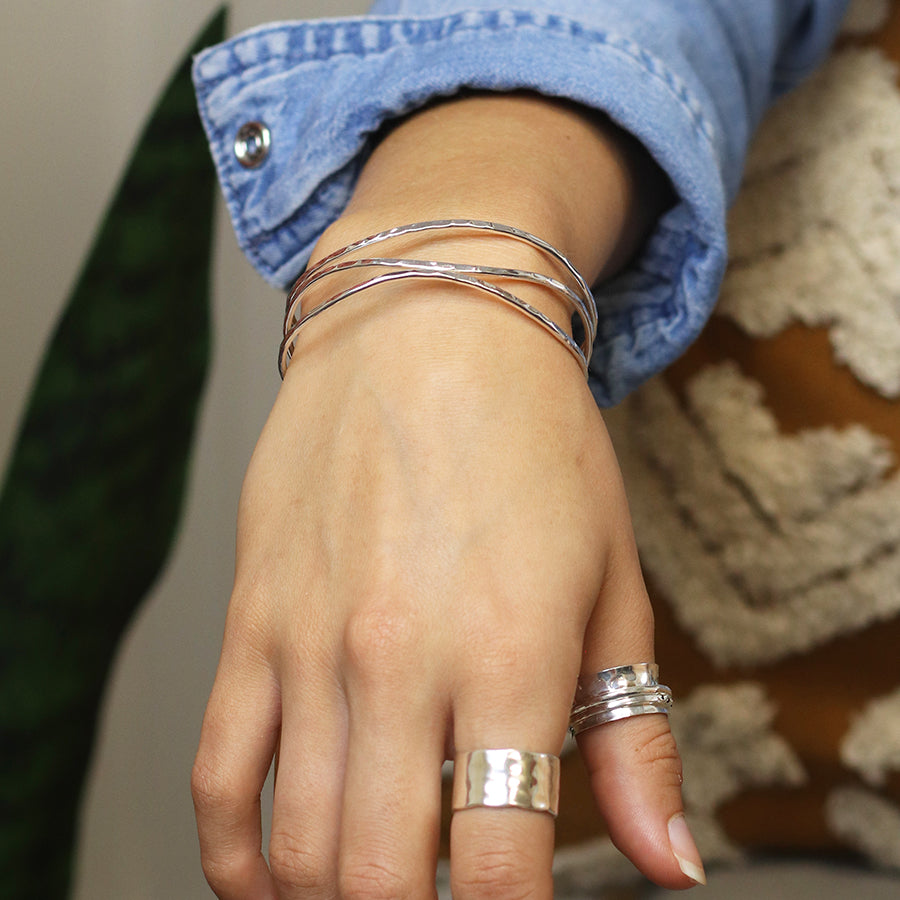 Silver plated hammered triple wave strand bangle