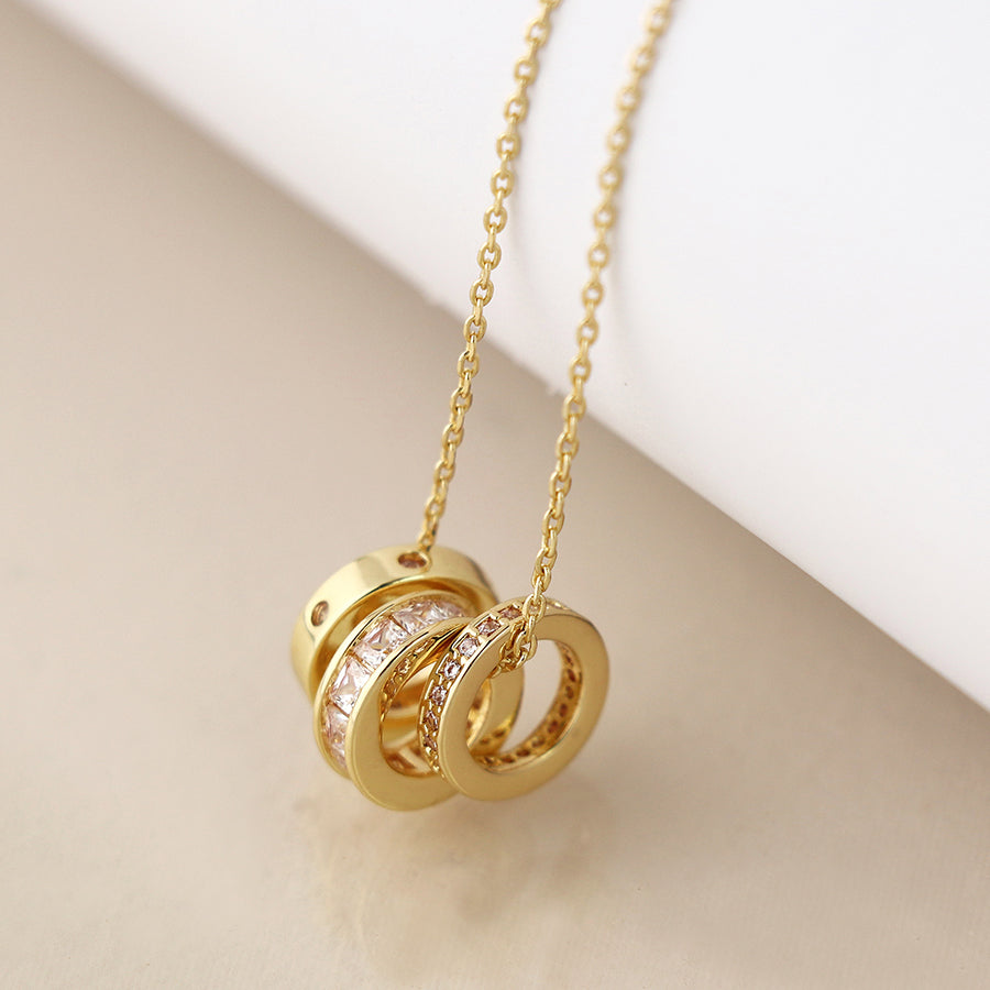 Gold plated triple mini crystal rings necklace