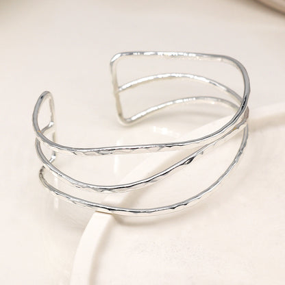 Silver plated hammered triple wave strand bangle
