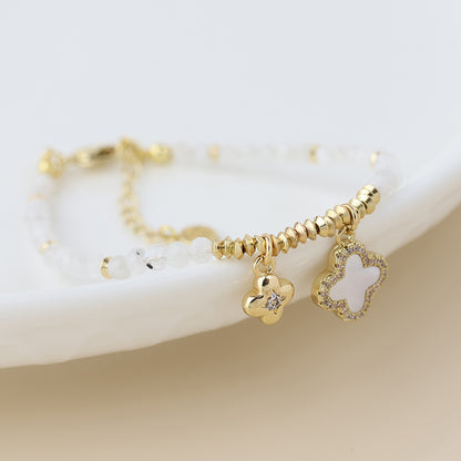 Golden and white bead quatrefoil charm bracelet