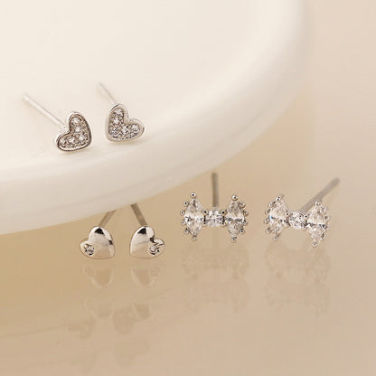 Silver plated bows and hearts triple stud earring set