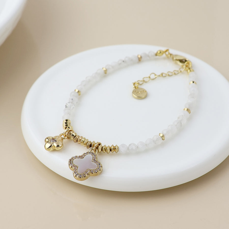 Golden and white bead quatrefoil charm bracelet