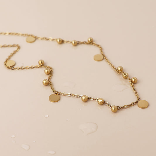 Waterproof gold plated bead and disc charm necklace